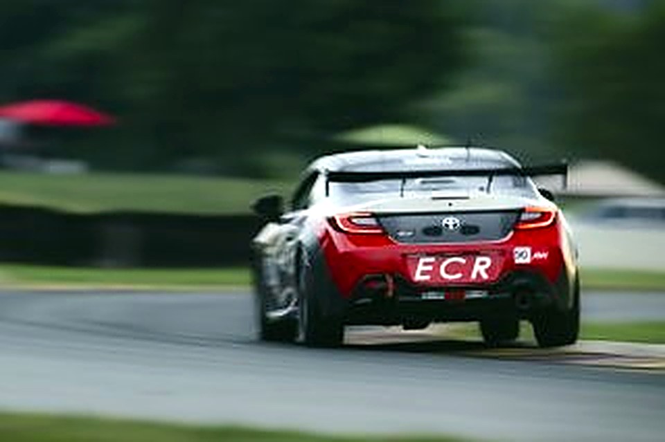 Rear view of the #90 with ECR plate under braking at Road America