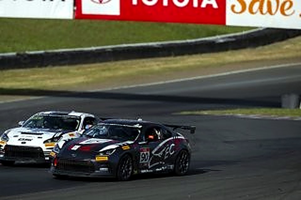 The #90 racing a white GR86 at Sonoma