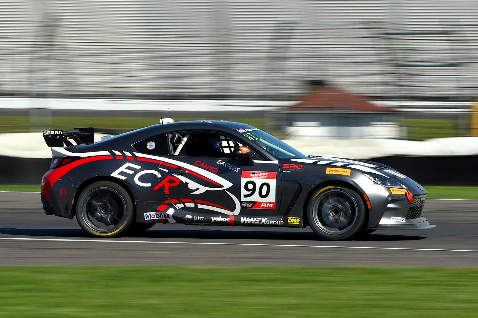 The #90 Toyota GR86 of Eagles Canyon Racing at speed at Indianapolis Motor Speedway